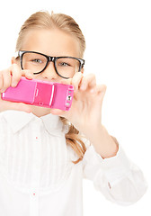 Image showing happy girl taking picture with cell phone