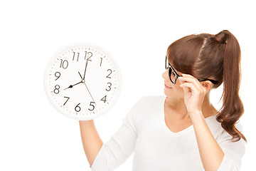 Image showing woman holding big clock