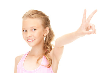 Image showing lovely girl showing victory sign