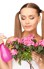 Image showing lovely housewife with flowers