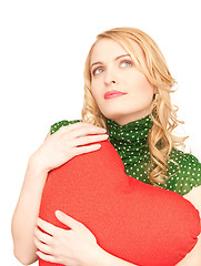 Image showing woman with red heart-shaped pillow