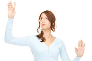 Image showing businesswoman working with something imaginary