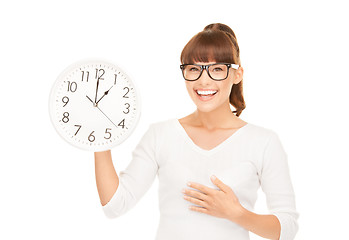 Image showing woman holding big clock