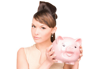 Image showing lovely woman with piggy bank