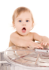 Image showing baby in trash can