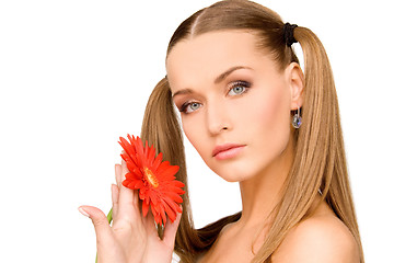 Image showing woman in towel with red flower