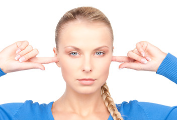 Image showing woman with fingers in ears