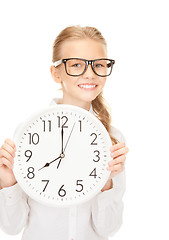 Image showing girl holding big clock