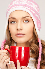 Image showing beautiful woman with red mug