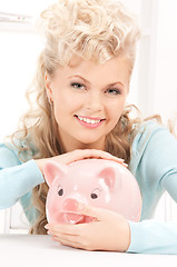 Image showing lovely woman with piggy bank