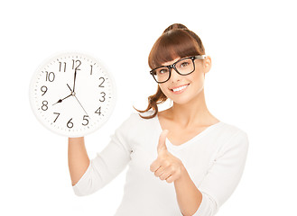 Image showing woman holding big clock