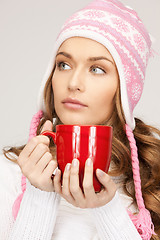 Image showing beautiful woman with red mug