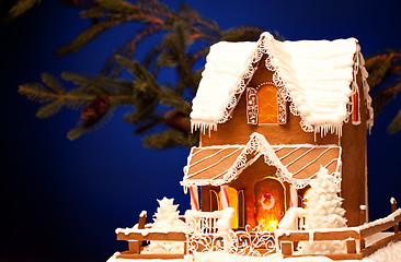 Image showing gingerbread house over christmas background