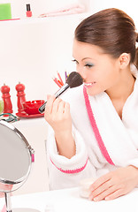 Image showing lovely woman with brush and mirror