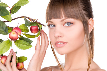 Image showing lovely woman with apple twig