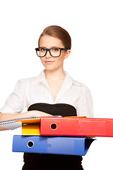 Image showing young attractive businesswoman with folders 