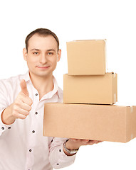 Image showing businessman with parcels