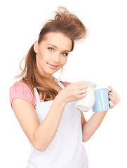 Image showing housewife with milk and mug