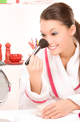 Image showing lovely woman with brush and mirror