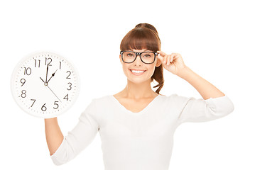 Image showing woman holding big clock
