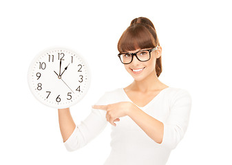 Image showing woman holding big clock