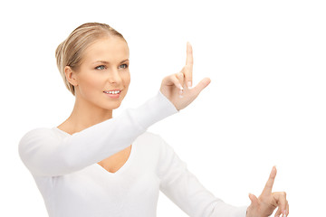 Image showing businesswoman working with something imaginary