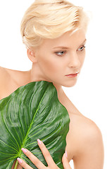 Image showing woman with green leaf