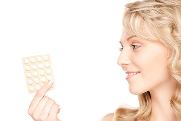 Image showing young woman with pills