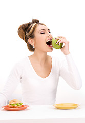 Image showing woman with green apple and sandwich