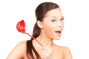 Image showing beautiful housewife with red ladle 