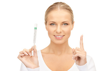 Image showing attractive female doctor with thermometer