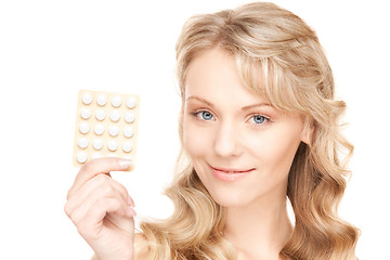 Image showing young woman with pills