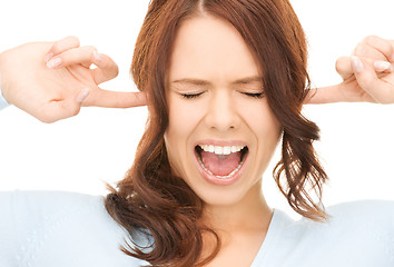 Image showing woman with fingers in ears