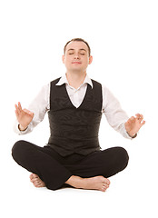 Image showing businessman sitting in lotus pose