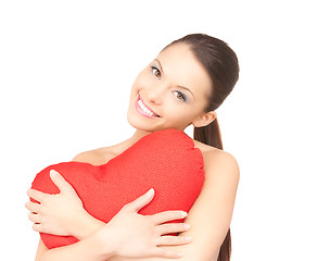 Image showing woman with red heart-shaped pillow over white 