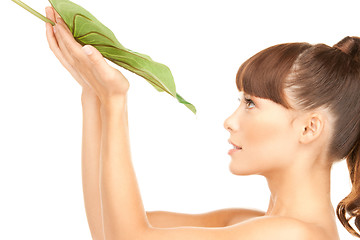 Image showing woman with green leaf