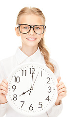 Image showing girl holding big clock