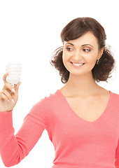 Image showing woman holding energy saving bulb