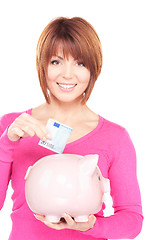 Image showing lovely woman with piggy bank and money