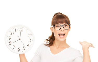 Image showing woman holding big clock