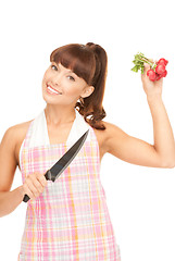 Image showing housewife with big knife and radish
