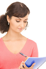 Image showing young attractive businesswoman with notebook