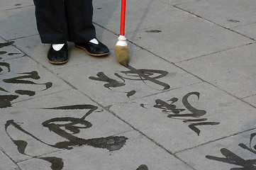 Image showing Writing with water