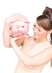 Image showing lovely woman with piggy bank