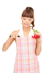 Image showing housewife with big knife and radish