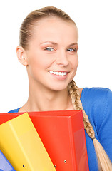 Image showing young attractive businesswoman with folders