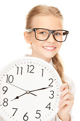 Image showing girl holding big clock