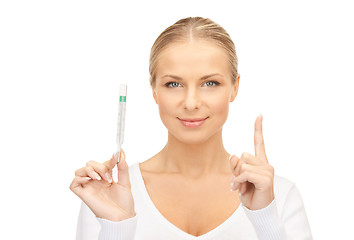 Image showing attractive female doctor with thermometer