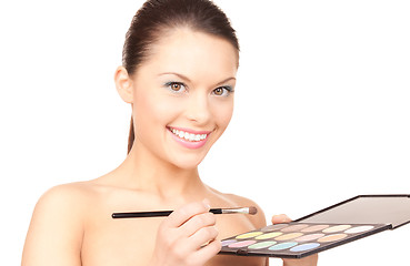 Image showing lovely woman with palette and brush