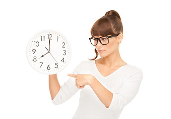 Image showing woman holding big clock